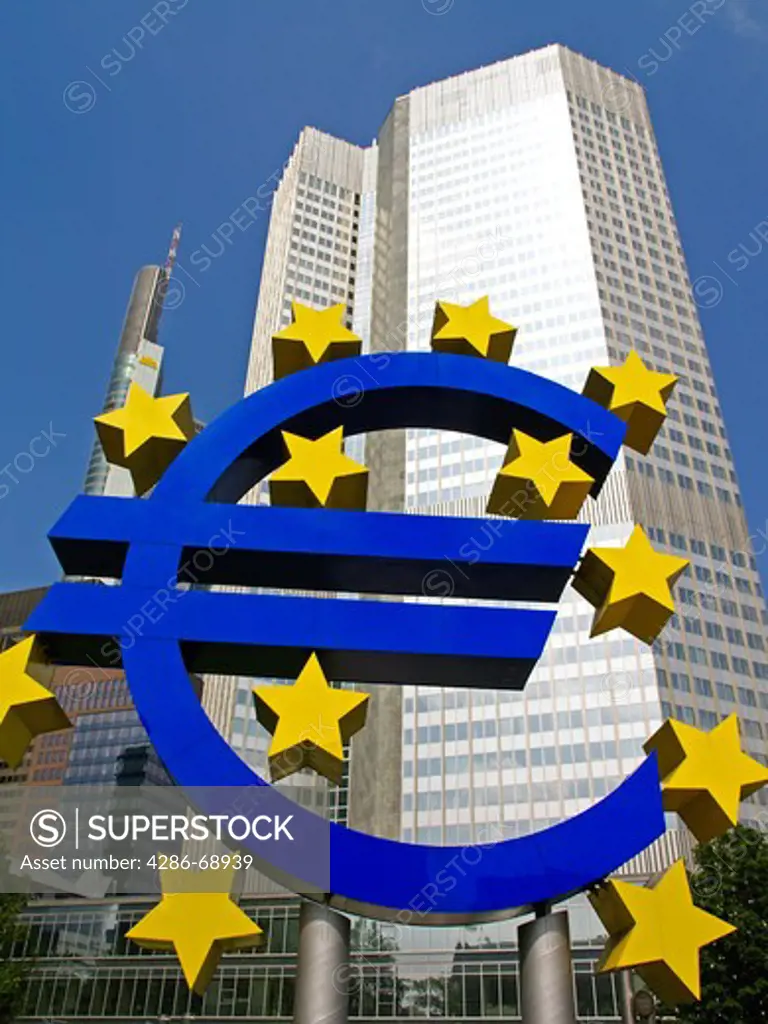 Euro Symbol in foreground of the European Central Bank in Frankurt Germany