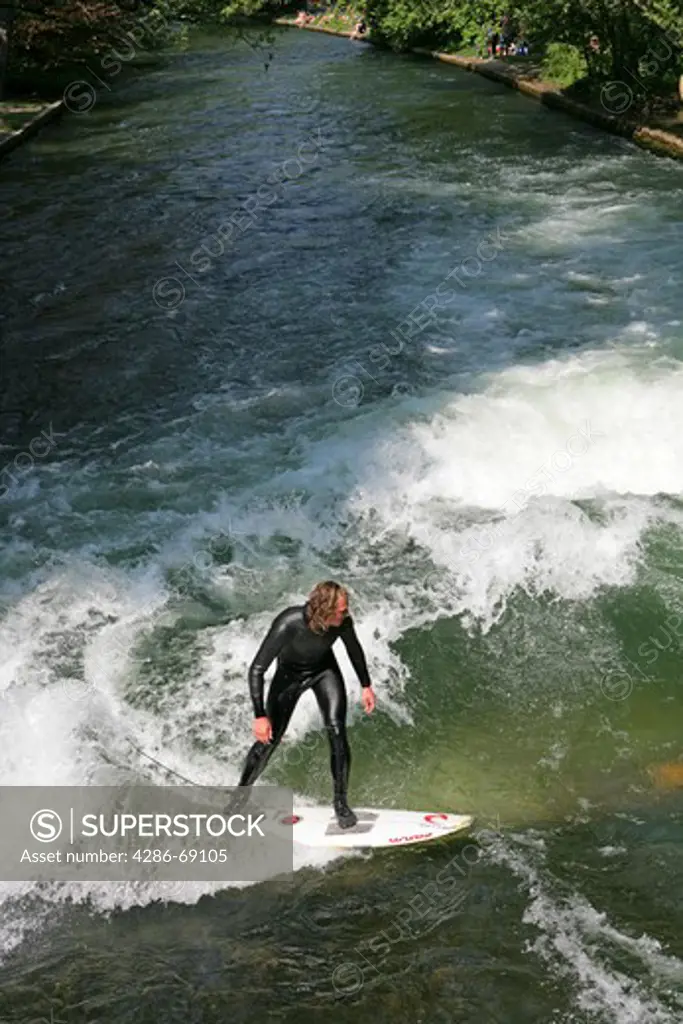Surfer on the River Isar Eisbach near Haus der Kunst Munich Bavaria Germany