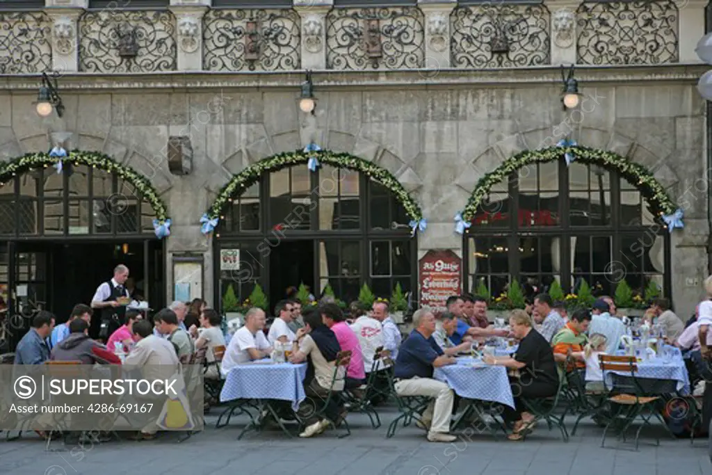 Germany Bavaria Munich People sitting outside the popular Augustiner restaurant