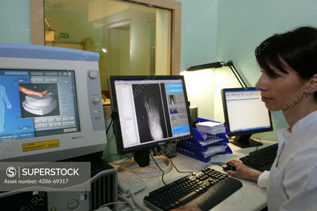 female doctor in X-ray control room at hospital