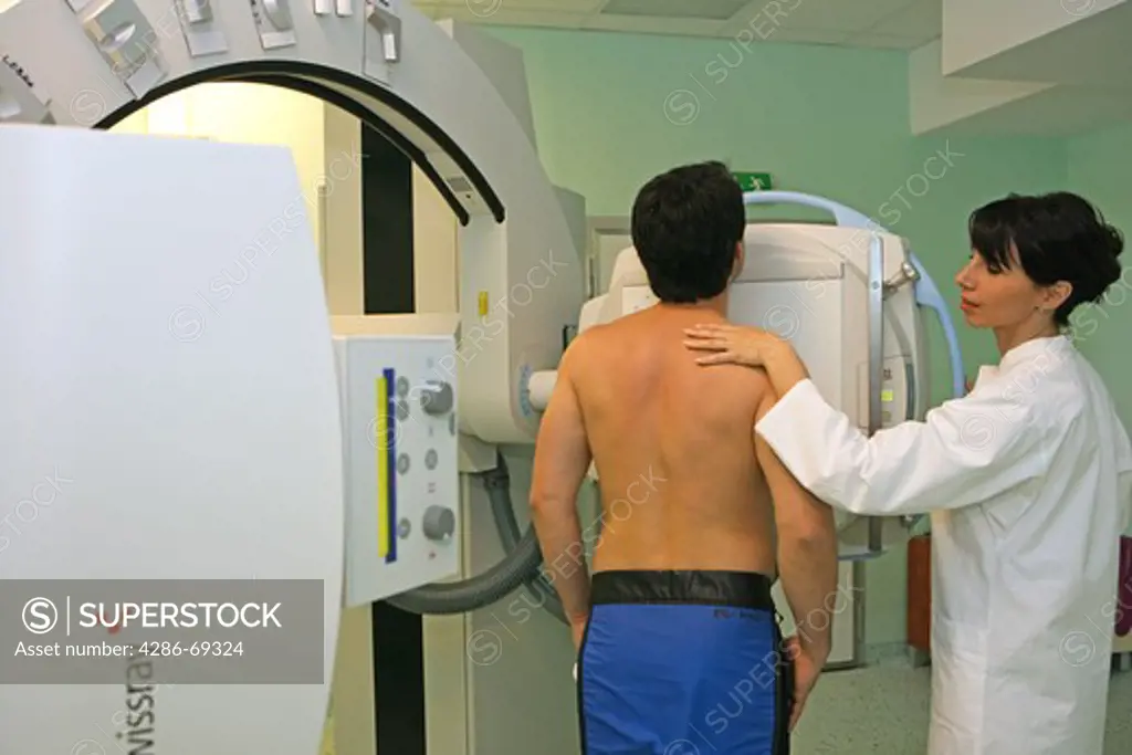 Radiographer taking x ray of patient
