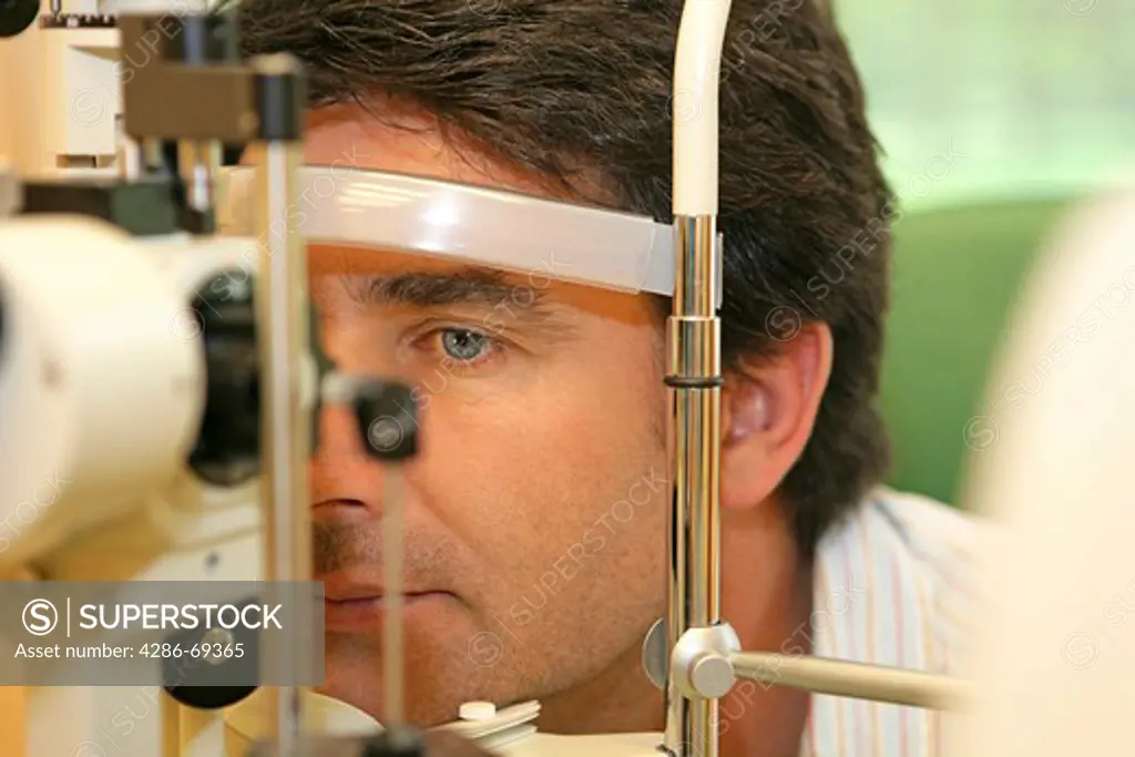 Doctor examines eye
