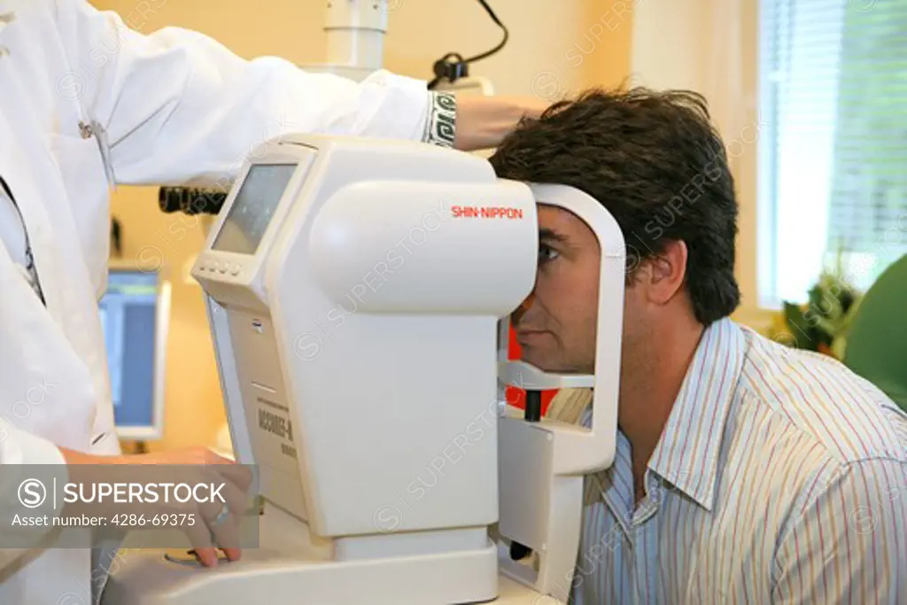 Doctor examines eye