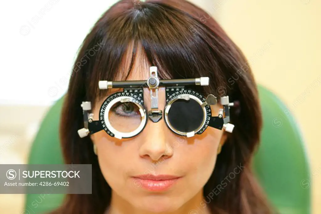 optometrist giving eye exam