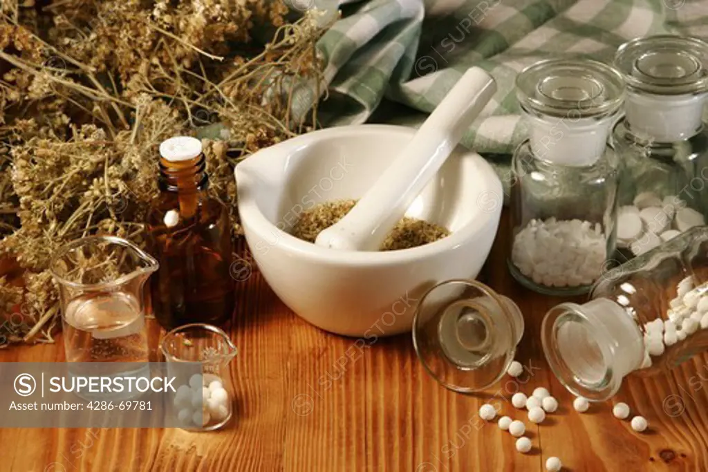 Homoeopathic medicine mortar and herbs
