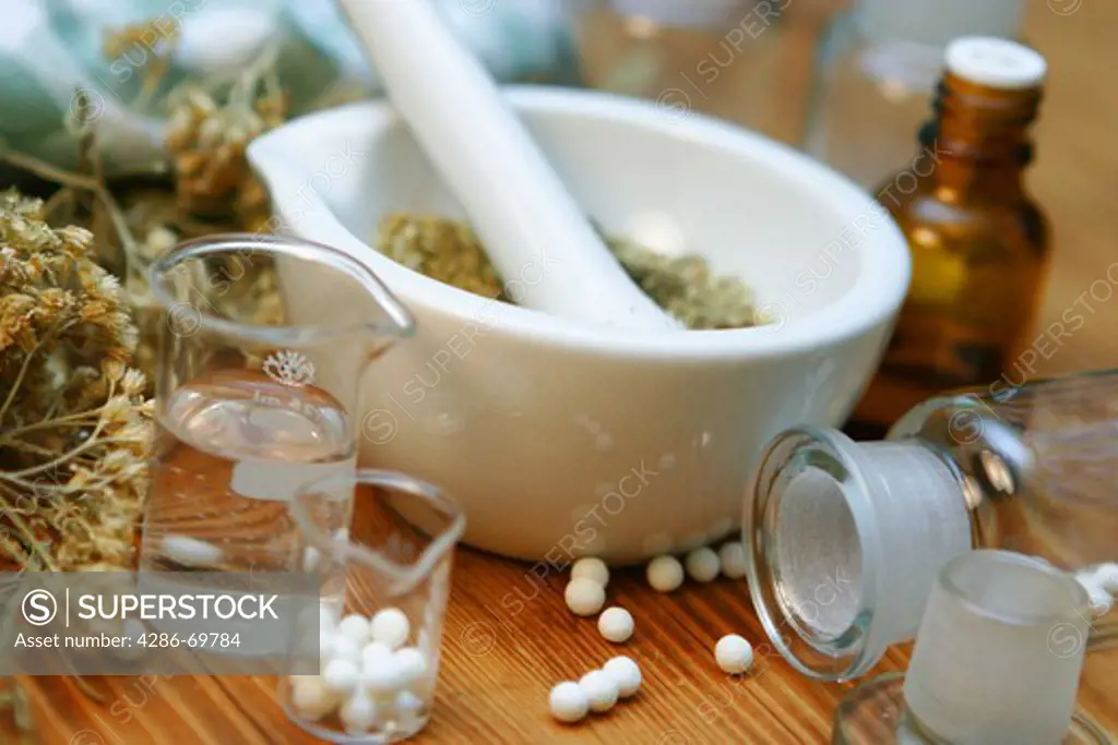 Homoeopathic medicine mortar and herbs