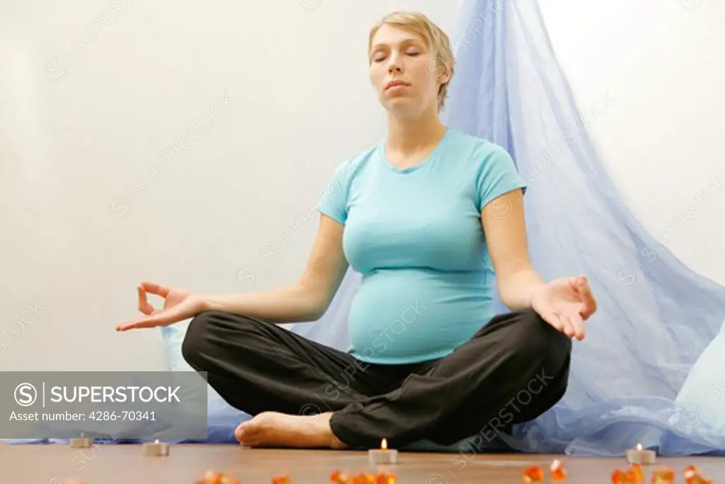 Pregnant women exercising yoga
