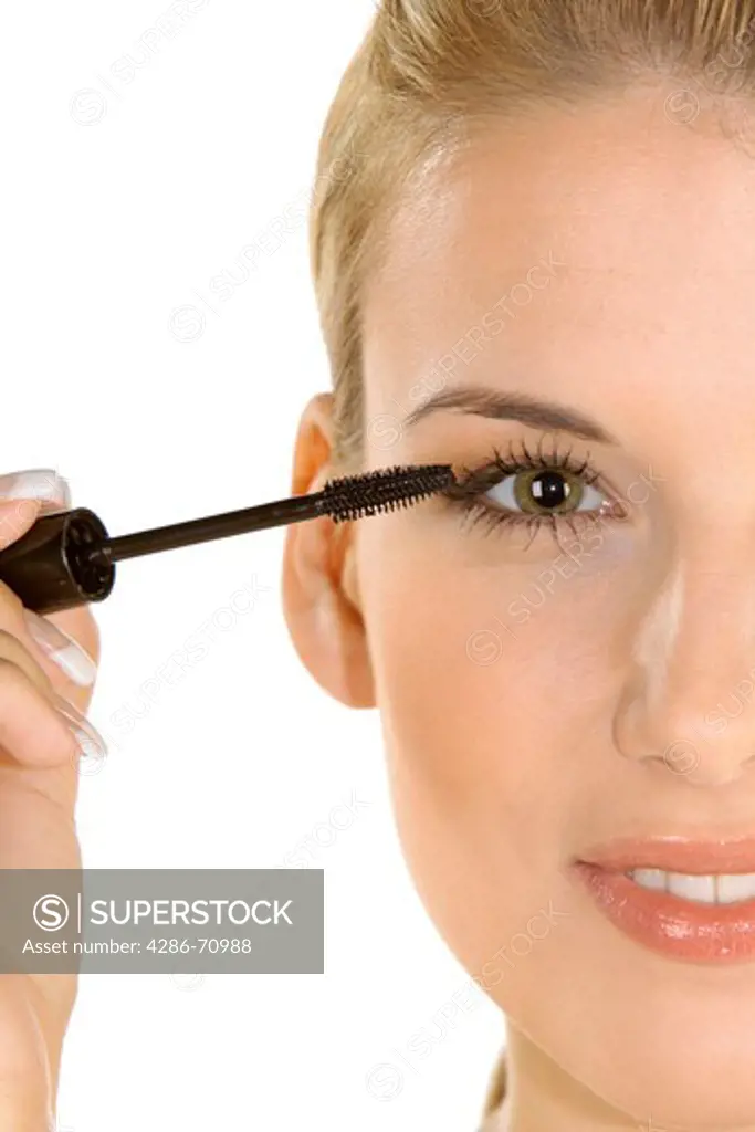 Woman uses mascara