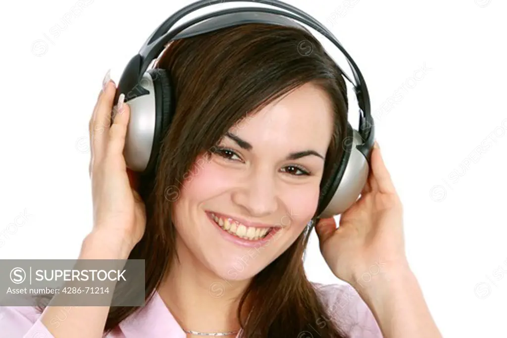 portrait of a young woman listening to music with headphone