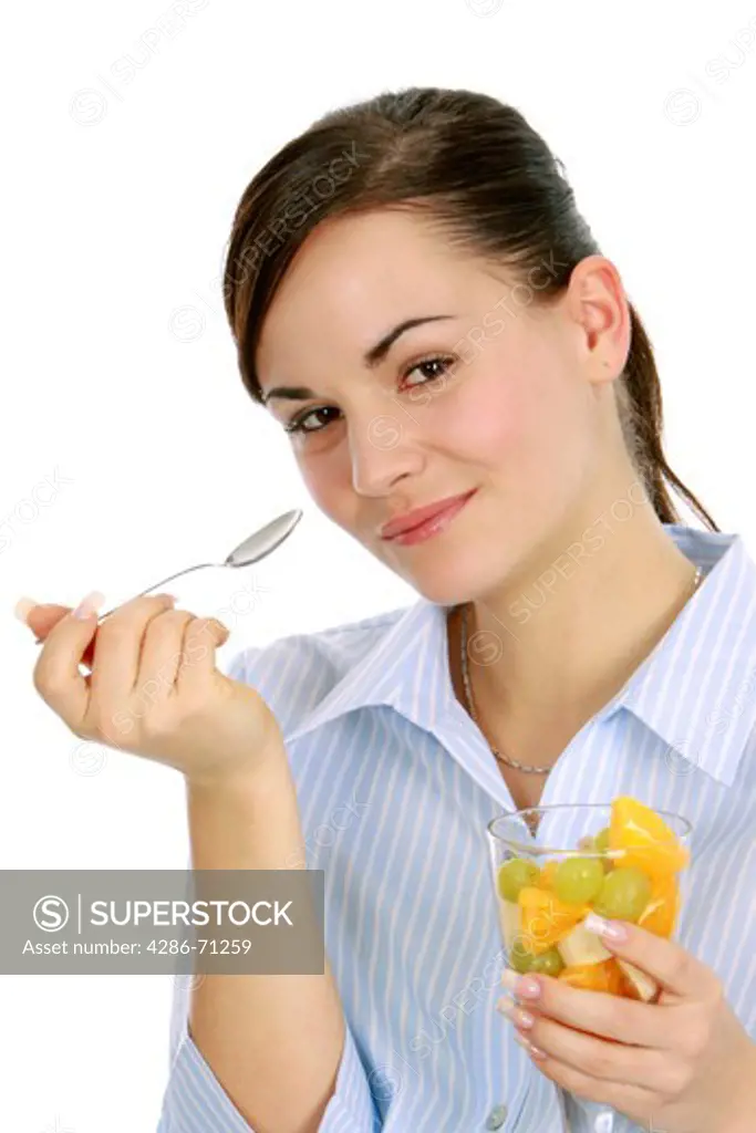 woman enjoys a fruit salad