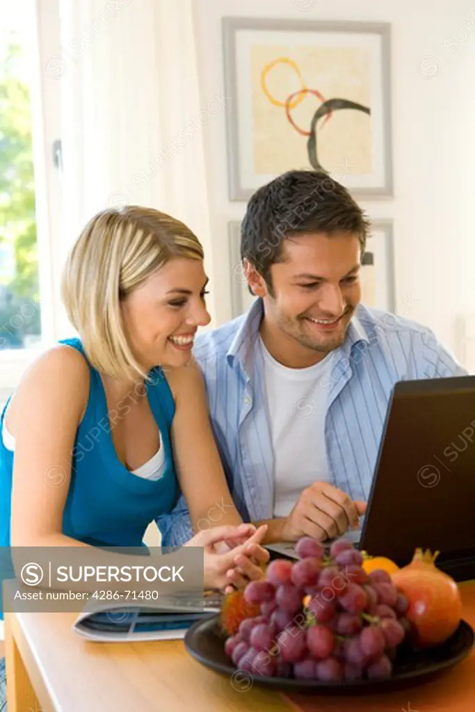 couple with a computer