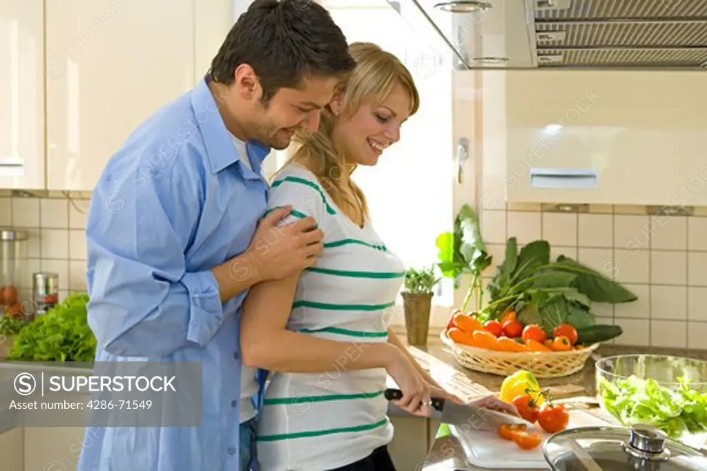 couple working in kitchen