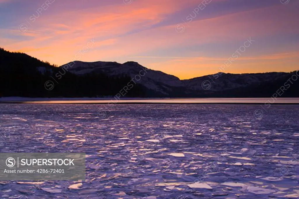 A frozen Donner Lake California at sunset
