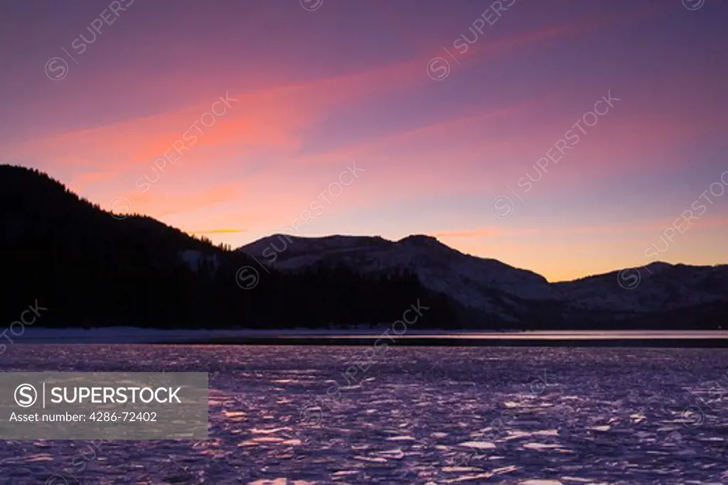 A frozen Donner Lake California at sunset