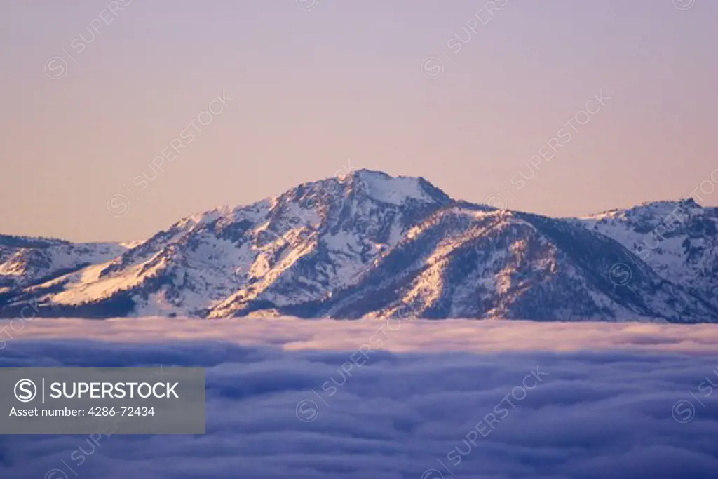 Sunrise and a sea of clouds over Lake Tahoe and Mount Tallac in winter in Nevada