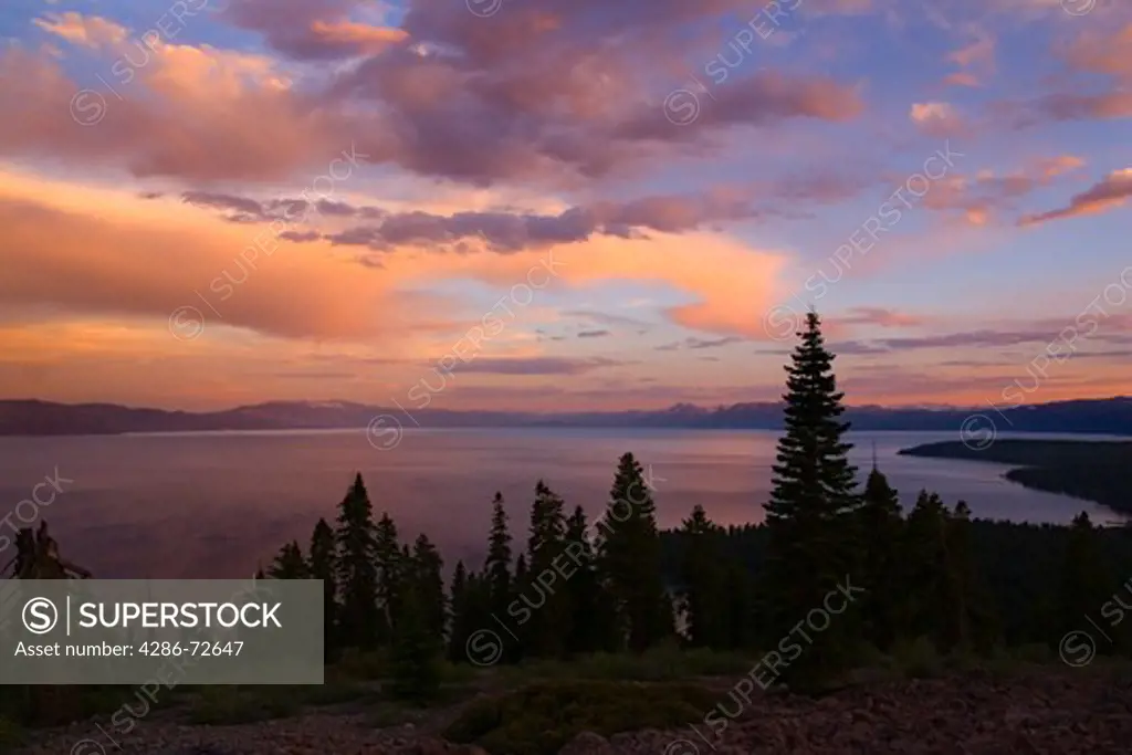 Storm clouds breaking up over Lake Tahoe at sunset
