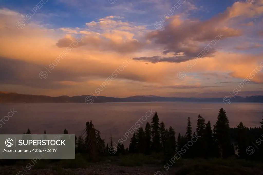 Storm clouds breaking up over Lake Tahoe at sunset