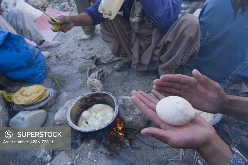 A Balti man making chapatis in Pakistan