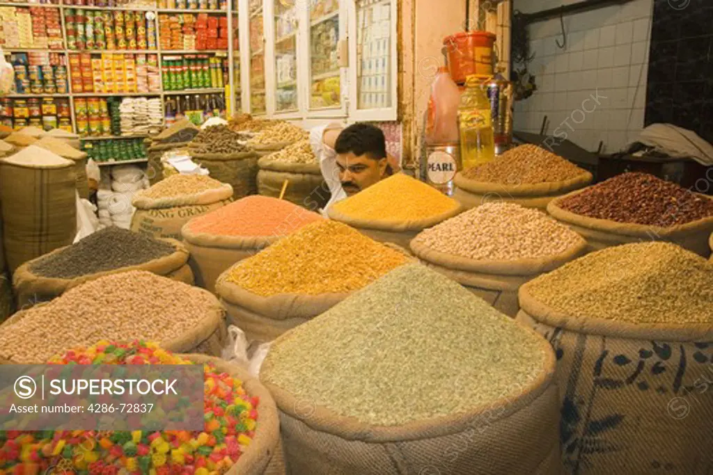 A shopkeeper selling grain in the old bazaar in Rawalpindi in Pakistan