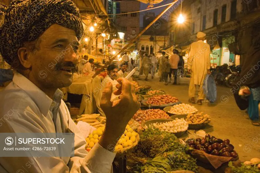 A fruit vendor in the old bazaar in Rawalpindi in Pakistan