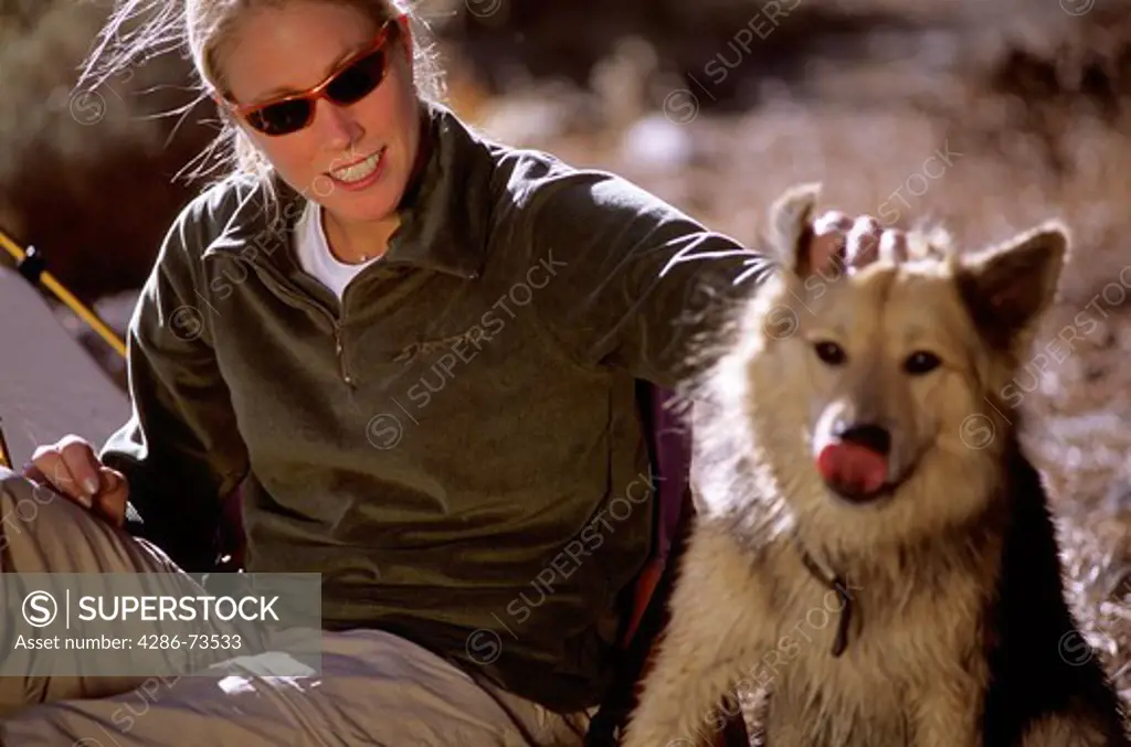 Young woman with dog in Truckee, California, USA