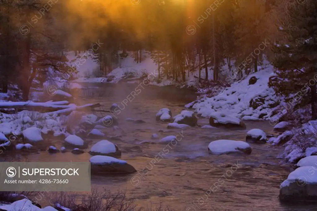 HDR tone mapped The Truckee River at dawn on a misty morning on a snowy day in winter in California