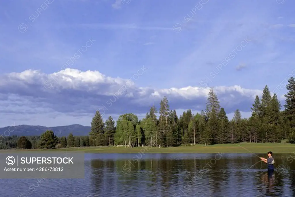 Man fly fishing at Stampede Reservoir near Truckee, California, USA 