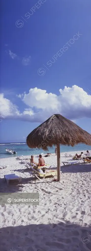 Mexico Quintana Roo Yucatan Peninsula Akumal Mayan Riviera,panorama view of beach and sea with palapa 