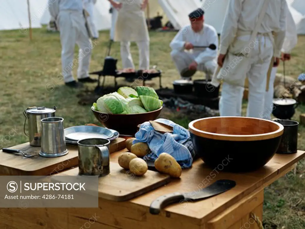 Canada,Ontario,Fort Erie, Old Fort Erie,reenactment of War of 1812,soldiers preparing a meal outdoors