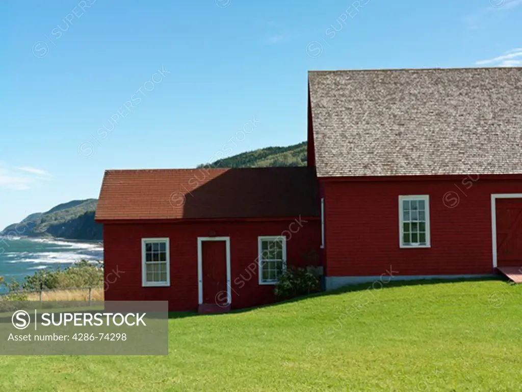 Canada Quebec Gaspesie La Martre,Musee des phares (Lighthouse Museum) red painted buildings against a blue sky