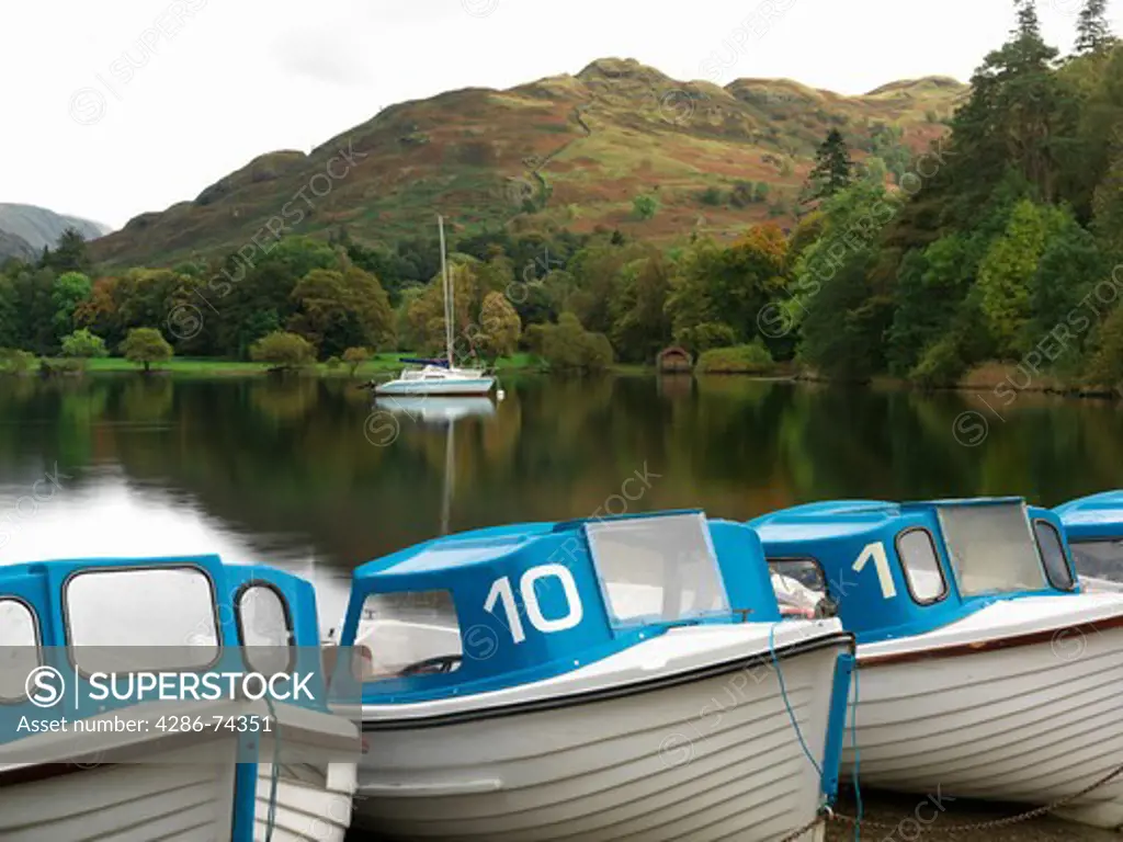United Kingdom Cumbria Lake District National Park Ullswater Glenridding, row of boats for rent at Ullswater