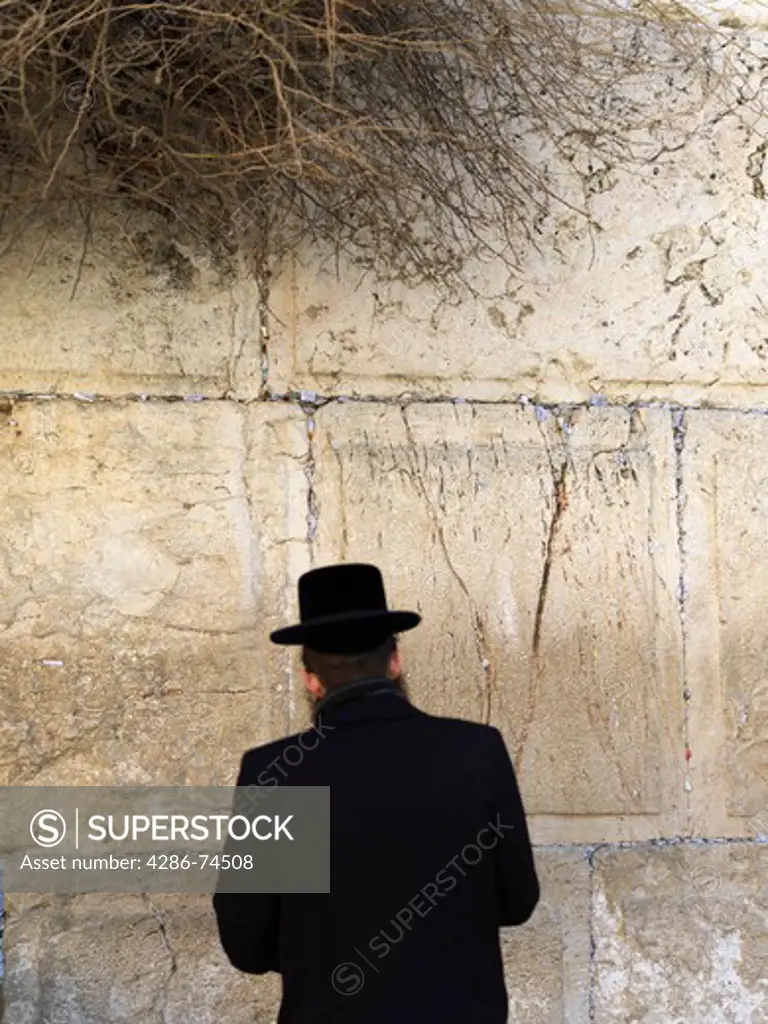 Israel, Jerusalem, Western Wall or Wailing Wall with worshipper