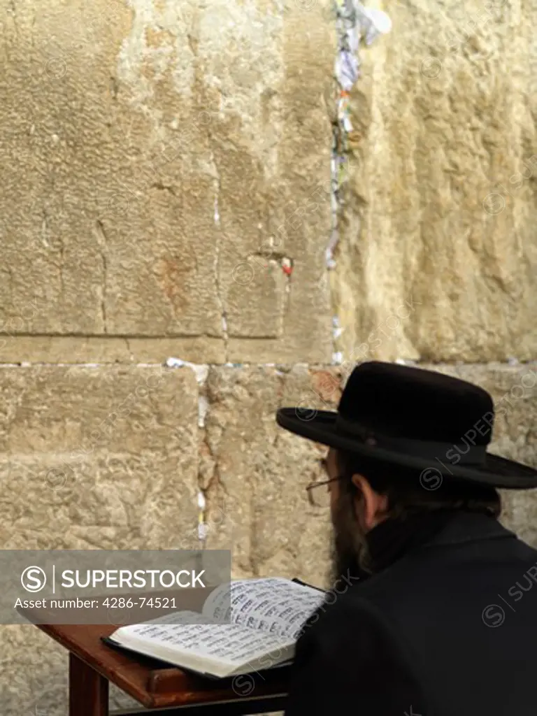 Israel, Jerusalem, Western Wall or Wailing Wall with worshipper