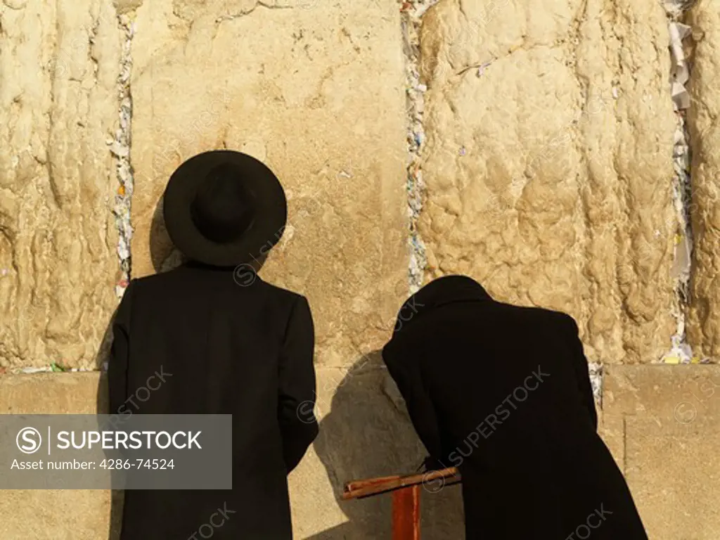 Israel, Jerusalem, Western Wall or Wailing Wall with worshipper and prayer slips
