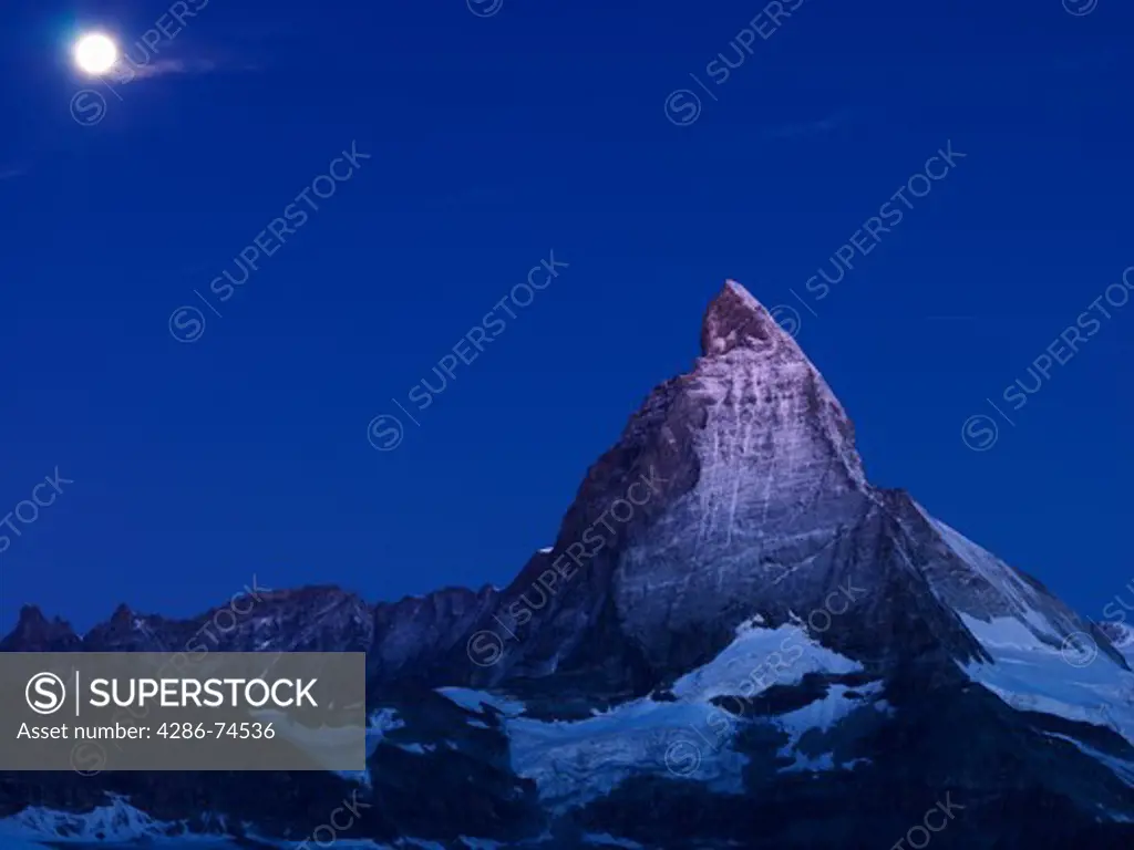 Switzerland, Valais, Zermatt, the Gornergrat,moon setting over the Matterhorn at dawn