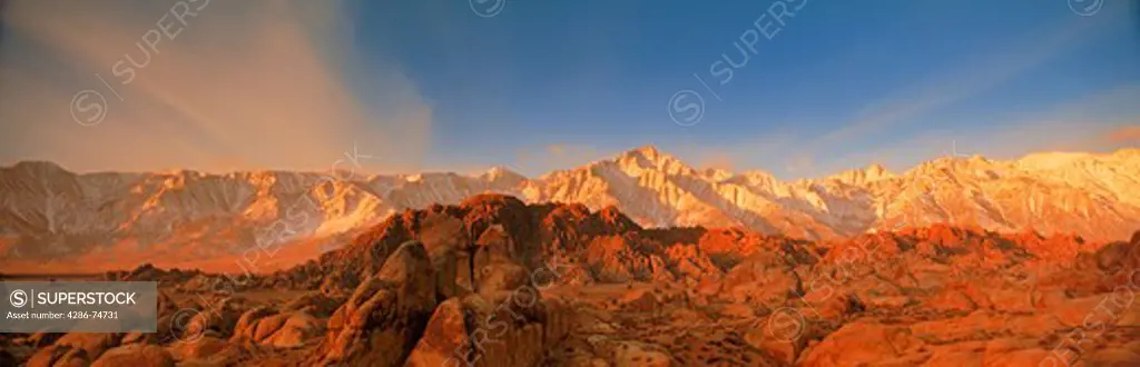 Mount Whitney on right and Lone Pine Peak in California Sierra Nevada Mountains over the Alabama Hills at sunrise