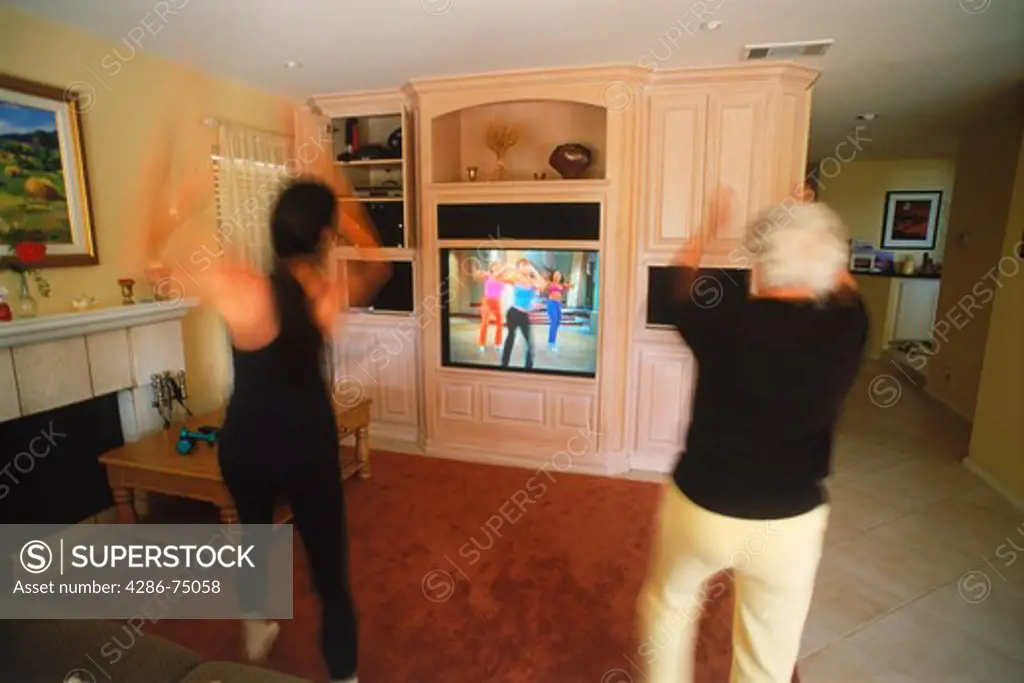 Mother and Grandmother exercising to home video