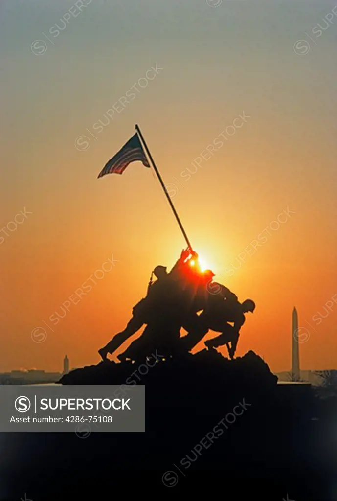 US Marine Corps War Memorial silhouetted in Arlington National Cemetery