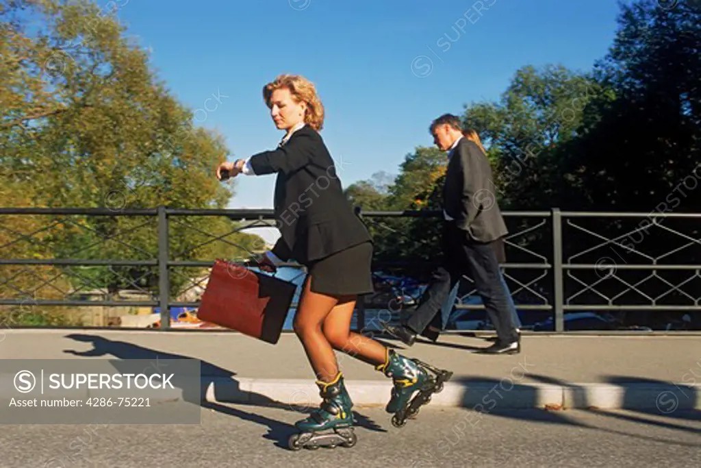 Businesswoman rollerblading to work in Stockholm