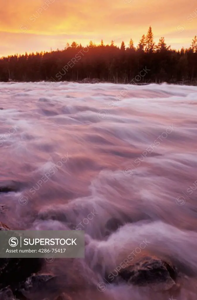 Mardsele Falls near Lappland Sweden like a cataract of fire ignited by sunset