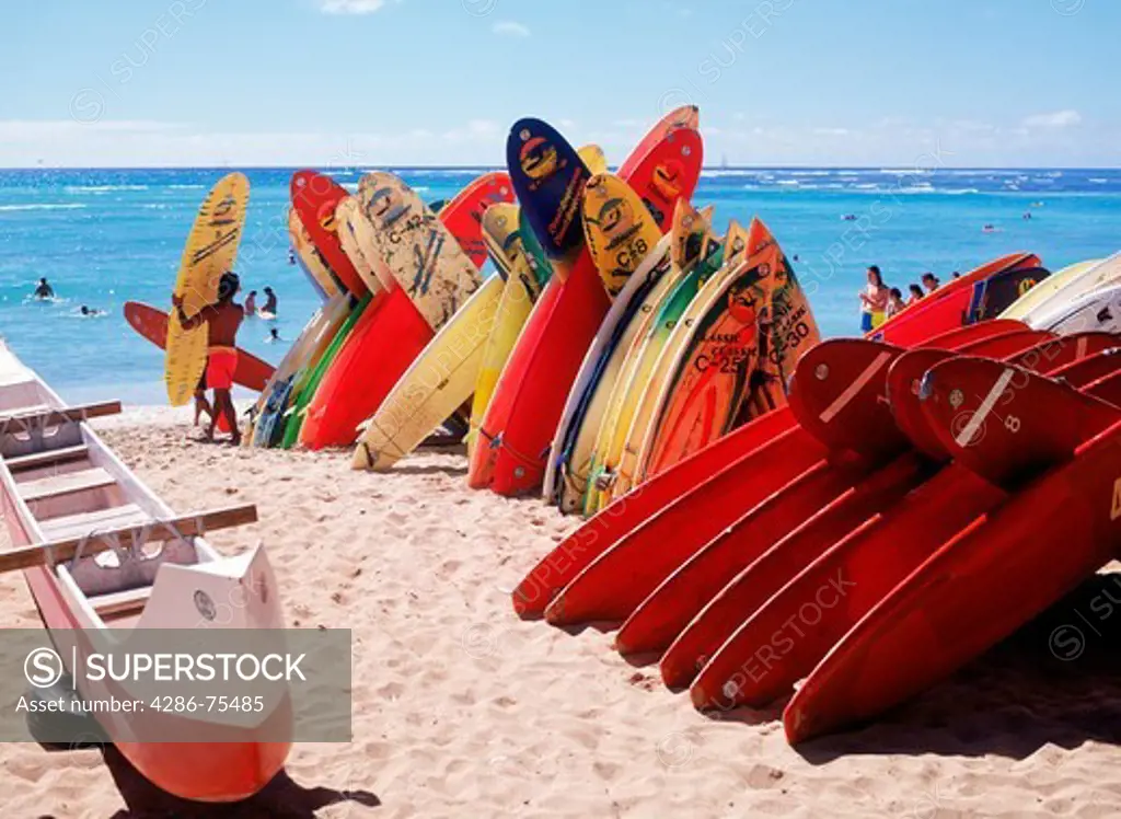 Surfboards stacked on Waikiki Beach in Honolulu on Oahu Island