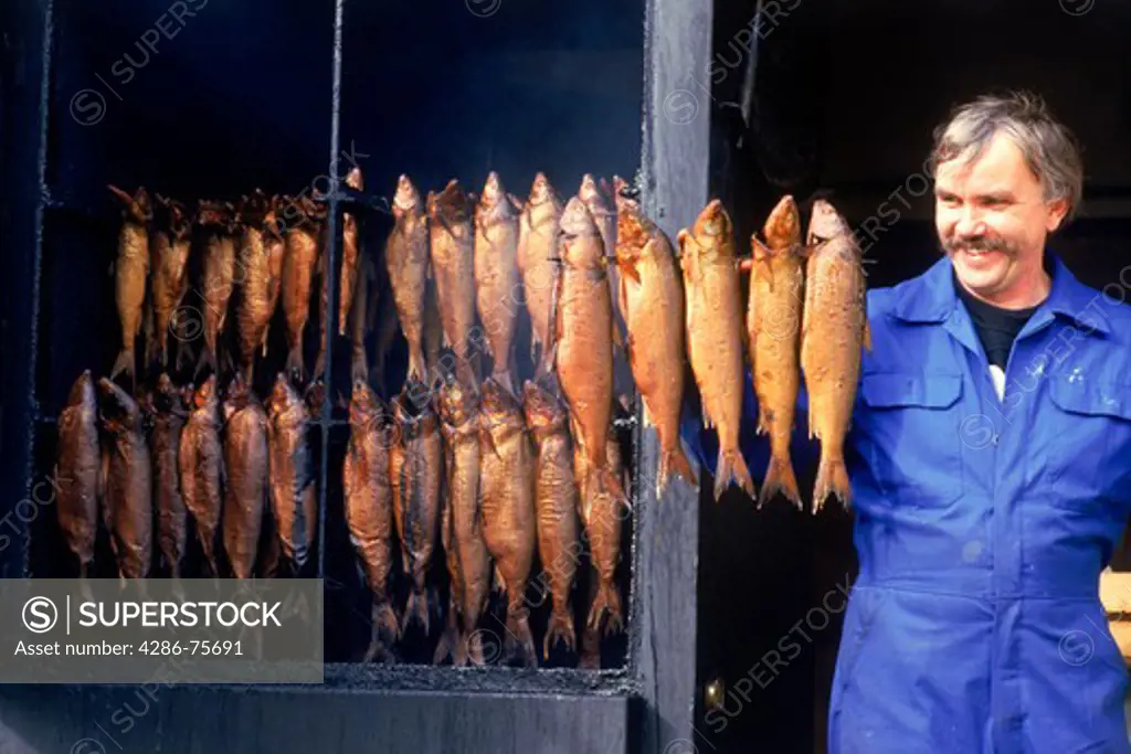 Man selling smoked herring on Sweden's Atlantic Coast