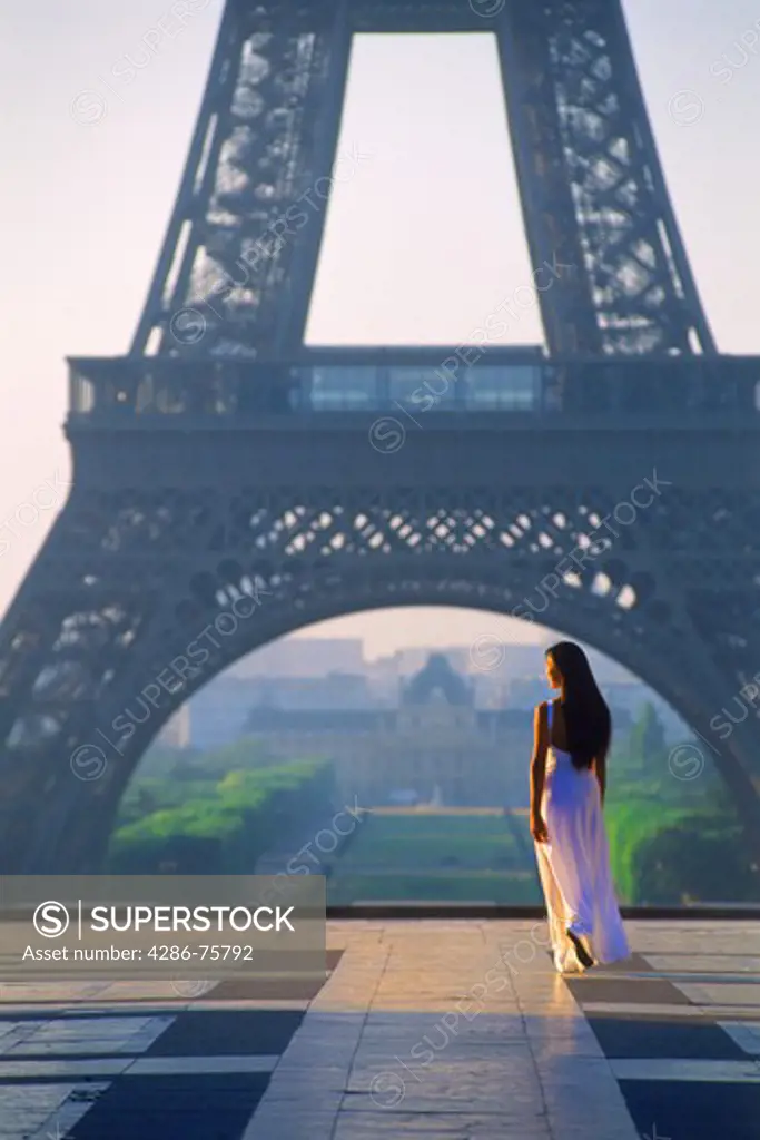 Woman alone at Palais de Chaillot in Trocadero at sunrise with Eiffel Tower