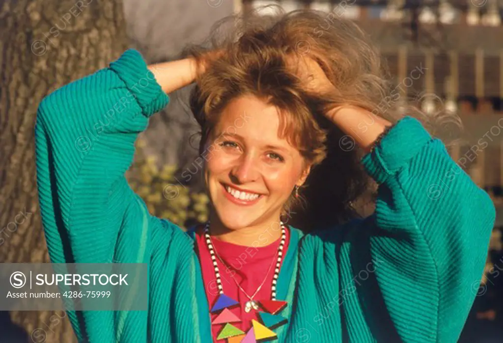 Woman wearing bright colored clothing and smile