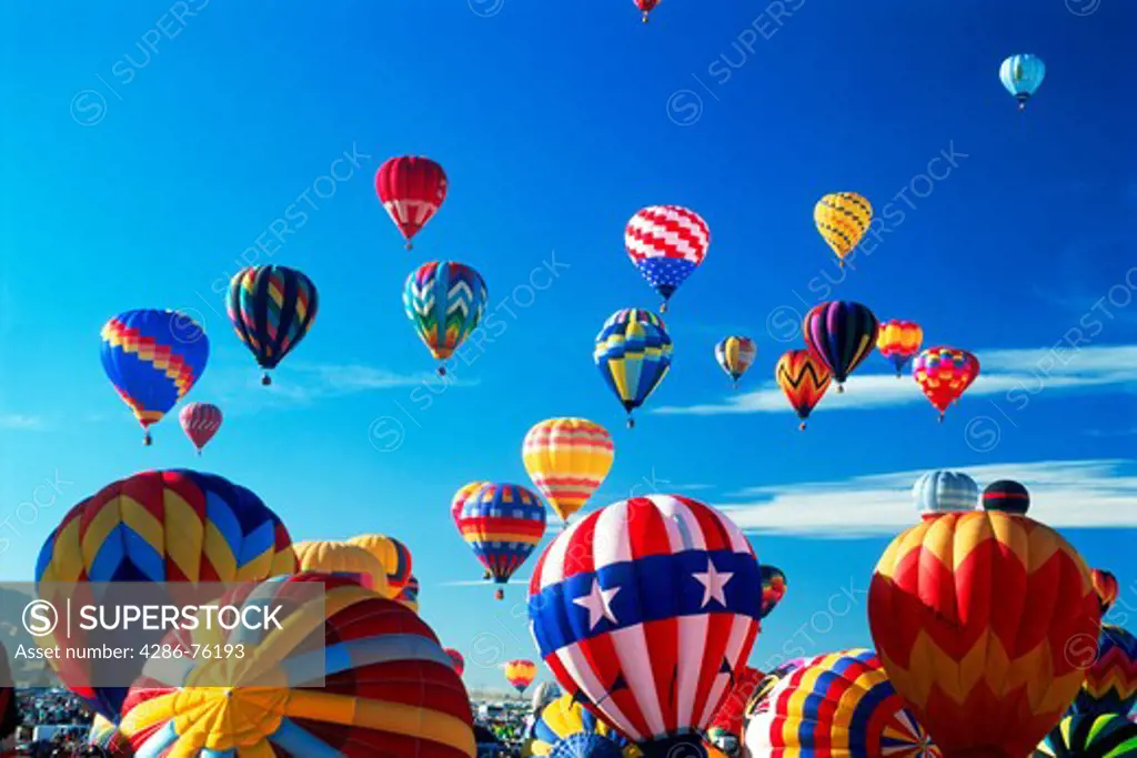 Hundreds of colorful balloons lifting off during festival in Albuquerque New Mexico