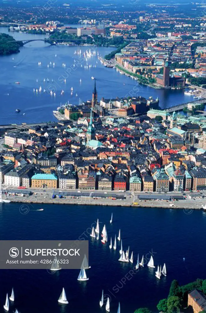Aerial view of sailboats on waters surrounding The Old Town of Stockholm during summer regatta