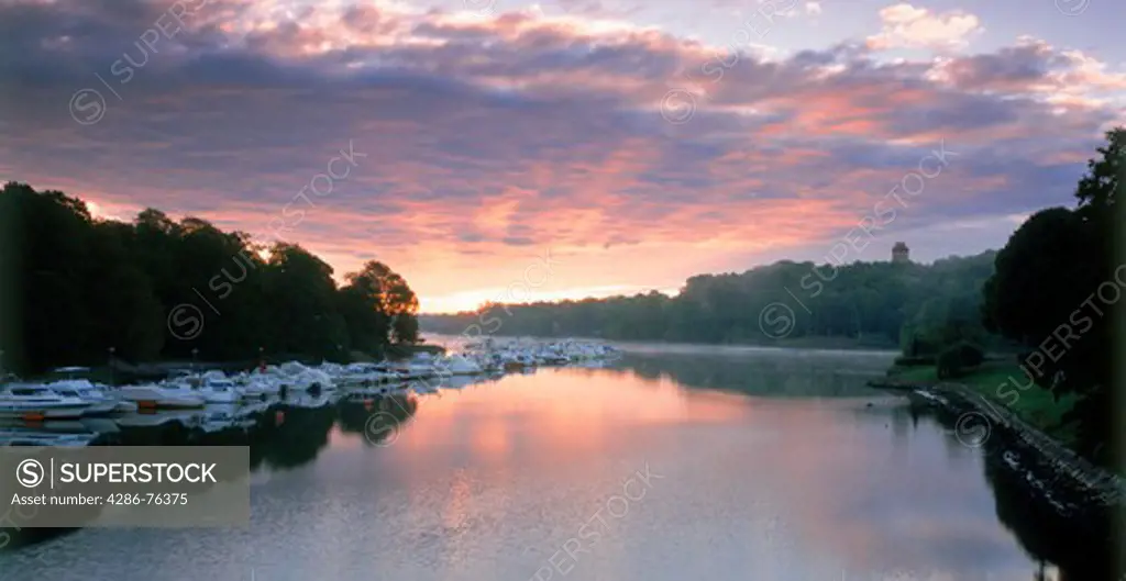 Sunrise over canal with moored boats at Djurgrden in Stockholm