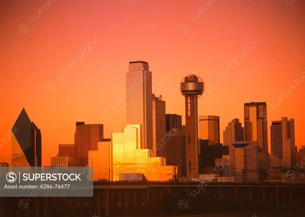 Sunset light and glowing skies reflecting off Dallas skyline