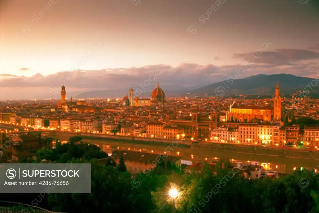 Florence on Arno River with Piazza della Signoria left Duomo center and Santa Croce Cathedral right in sunset light
