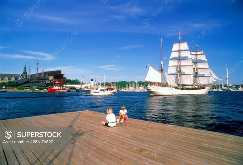 Summer sails on Nybroviken waters with Vasa Museum on Djurgrden in Stockholm